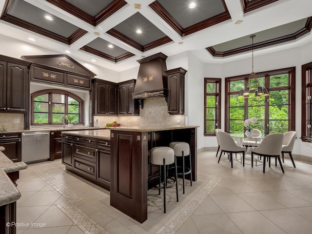 11315 77th St, Burr Ridge, IL 60527 - kitchen with stainless steel dishwasher, inlaid floor details, premium range hood, light stone countertops, and a kitchen island