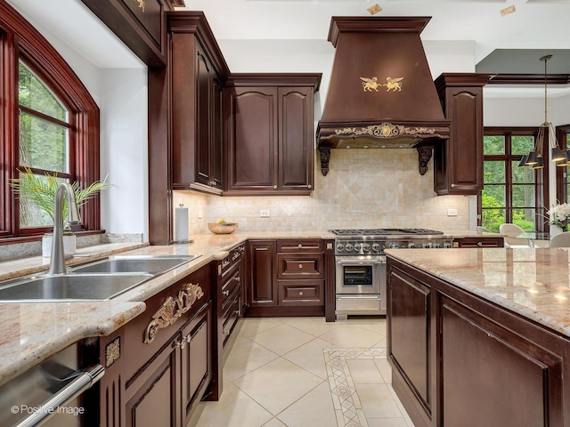 11315 77th St, Burr Ridge, IL 60527 - kitchen featuring premium range hood, range with two ovens, light tile patterned floors, decorative backsplash, and light stone counters