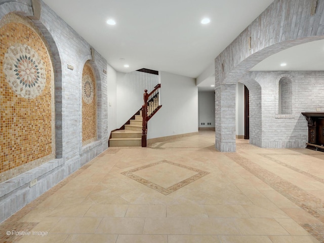 11315 77th St, Burr Ridge, IL 60527 - basement featuring recessed lighting, inlaid floor details, tile patterned flooring, stairway, and arched walkways
