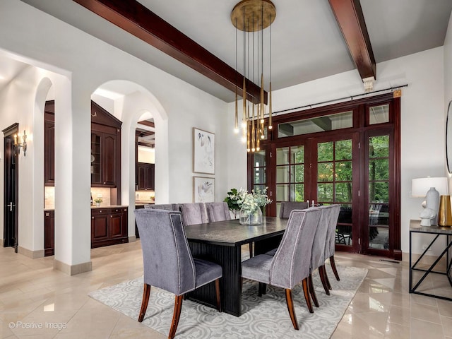 11315 77th St, Burr Ridge, IL 60527 - dining room with arched walkways, beam ceiling, and light tile patterned floors