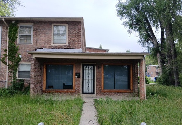 254 E 92nd St, Chicago, IL 60619 - view of front of house with brick siding