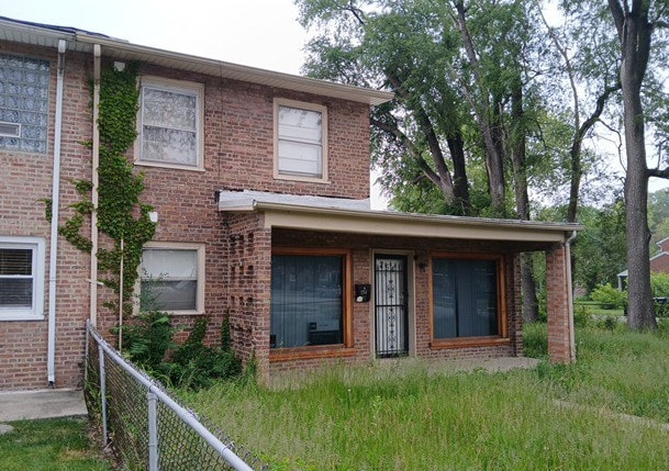 254 E 92nd St, Chicago, IL 60619 - view of front facade featuring brick siding