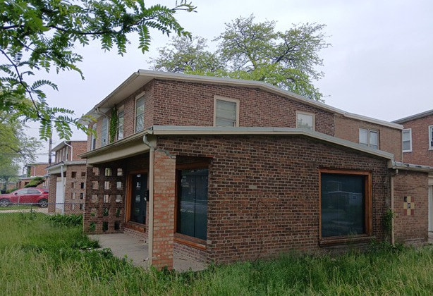 254 E 92nd St, Chicago, IL 60619 - view of side of home with brick siding
