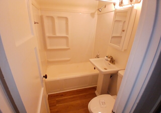 254 E 92nd St, Chicago, IL 60619 - bathroom featuring toilet, wood finished floors, and shower / bath combination