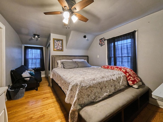 7314 W 58th St, Summit, IL 60501 - bedroom with light wood-style flooring, vaulted ceiling, and a ceiling fan