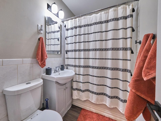 7314 W 58th St, Summit, IL 60501 - full bath with vanity, toilet, wood finished floors, tile walls, and shower / tub combo
