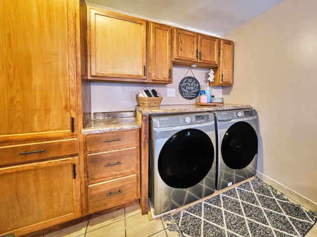 7314 W 58th St, Summit, IL 60501 - laundry room featuring washer and dryer, cabinet space, light tile patterned flooring, and baseboards