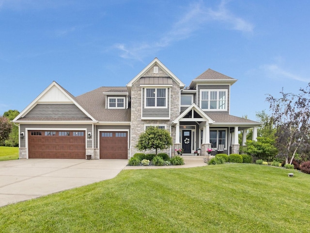 7166 Clubhouse Dr, Yorkville, IL 60560 - craftsman house with stone siding, concrete driveway, a front lawn, an attached garage, and a shingled roof