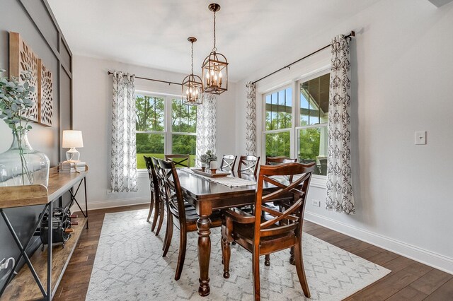 7166 Clubhouse Dr, Yorkville, IL 60560 - dining area with a chandelier, healthy amount of natural light, dark wood finished floors, and baseboards