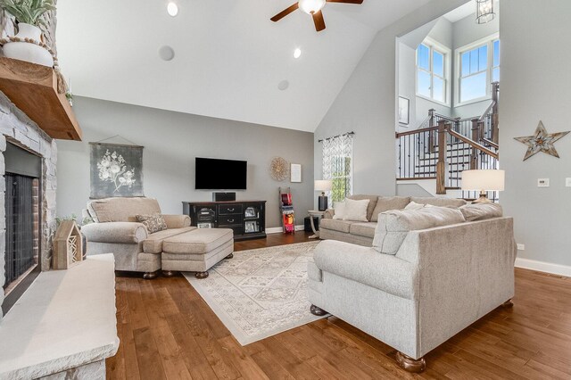 7166 Clubhouse Dr, Yorkville, IL 60560 - living area with high vaulted ceiling, ceiling fan, wood finished floors, healthy amount of natural light, and baseboards