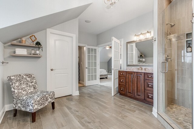 7166 Clubhouse Dr, Yorkville, IL 60560 - full bathroom featuring a shower stall, vanity, wood finished floors, connected bathroom, and french doors