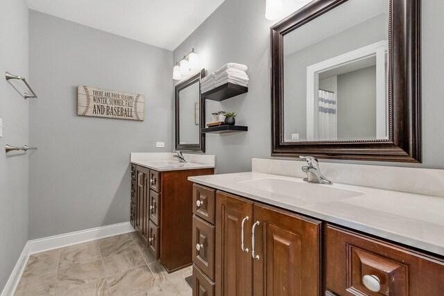 7166 Clubhouse Dr, Yorkville, IL 60560 - bathroom with baseboards, two vanities, and marble look tiles