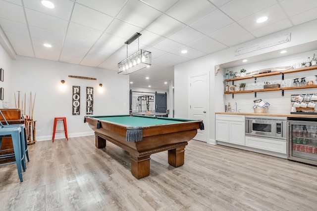 7166 Clubhouse Dr, Yorkville, IL 60560 - game room with light wood-style flooring, billiards table, recessed lighting, bar area, and a paneled ceiling