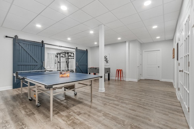 7166 Clubhouse Dr, Yorkville, IL 60560 - playroom with a barn door, baseboards, light wood-style floors, and recessed lighting