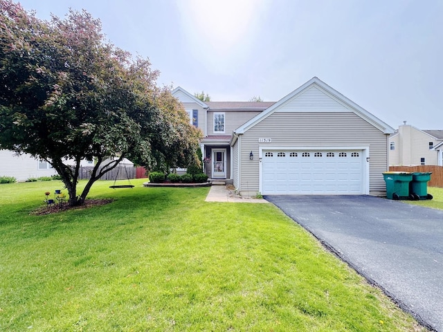 11319 Maplewood Dr, Plainfield, IL 60585 - view of front of home featuring driveway, a garage, and a front lawn
