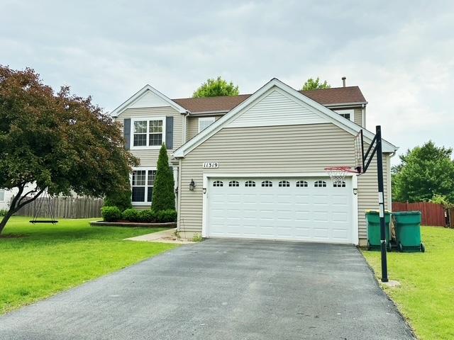 11319 Maplewood Dr, Plainfield, IL 60585 - traditional home featuring driveway and an attached garage