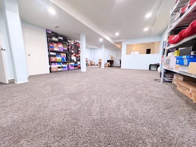 11319 Maplewood Dr, Plainfield, IL 60585 - finished below grade area with carpet flooring