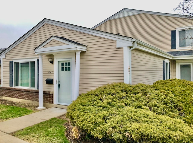 1547 Quaker Ln Unit 1547, Prospect Heights, IL 60070 - view of exterior entry featuring brick siding