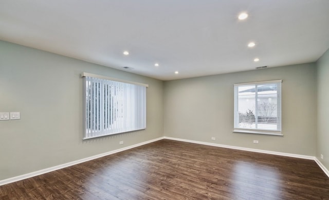 1547 Quaker Ln Unit 1547, Prospect Heights, IL 60070 - empty room with dark wood-type flooring, baseboards, and recessed lighting