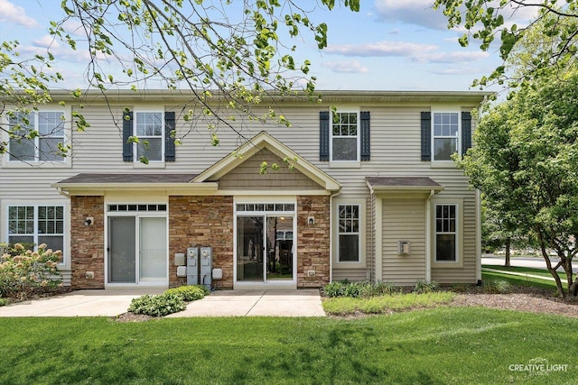 6N307 Whitmore Cir Unit A, Saint Charles, IL 60174 - rear view of property with a yard, a patio area, and stone siding