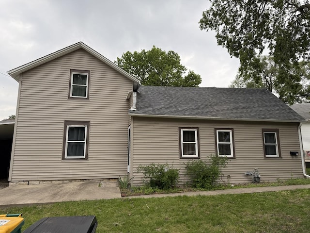 119 S Washington St, Wilmington, IL 60481 - back of property featuring a yard, a patio, and a shingled roof