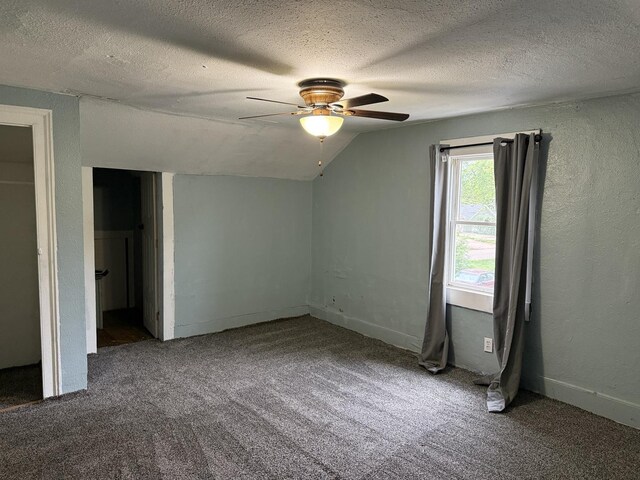 119 S Washington St, Wilmington, IL 60481 - unfurnished bedroom with carpet, vaulted ceiling, a textured ceiling, and ceiling fan