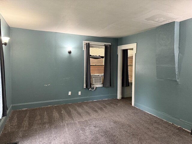 119 S Washington St, Wilmington, IL 60481 - carpeted empty room featuring cooling unit and baseboards
