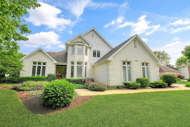 1537 Monarch Cir, Naperville, IL 60564 - view of front of house with brick siding, a front lawn, and a shingled roof