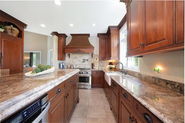 1537 Monarch Cir, Naperville, IL 60564 - kitchen with custom range hood, high end range, a sink, decorative backsplash, and light stone counters