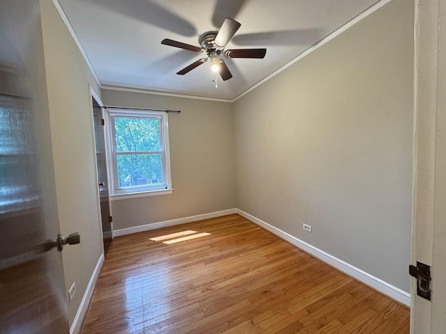 6649 S Karlov Ave, Chicago, IL 60629 - spare room with crown molding, ceiling fan, baseboards, and light wood-type flooring