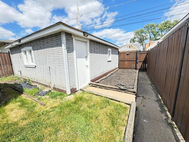 6649 S Karlov Ave, Chicago, IL 60629 - view of side of home featuring brick siding and a garden