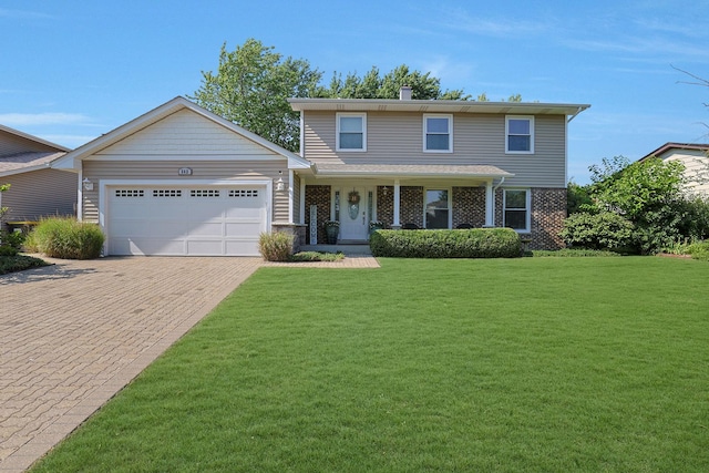 562 Revere Ave, Westmont, IL 60559 - view of front of house featuring an attached garage, a front lawn, decorative driveway, and brick siding