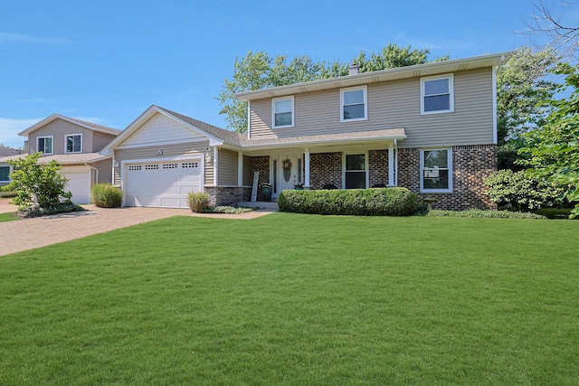 562 Revere Ave, Westmont, IL 60559 - view of front facade featuring an attached garage, a front yard, driveway, covered porch, and brick siding