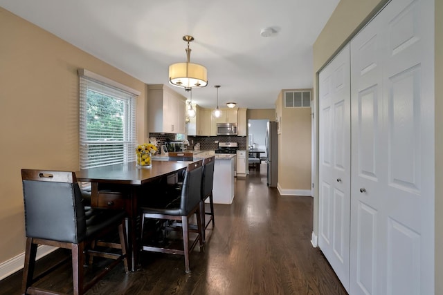 562 Revere Ave, Westmont, IL 60559 - dining space with dark wood-type flooring