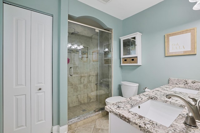 562 Revere Ave, Westmont, IL 60559 - bathroom featuring vanity, a shower stall, a closet, and marble finish flooring