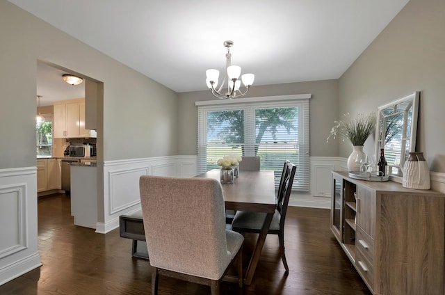 562 Revere Ave, Westmont, IL 60559 - dining room featuring plenty of natural light, a wainscoted wall, a chandelier, a decorative wall, and dark wood-style floors