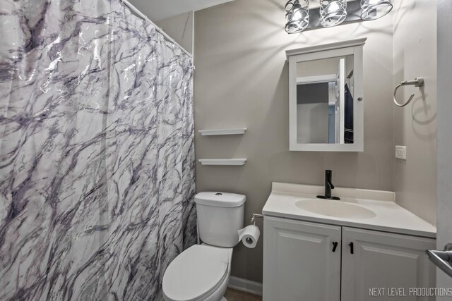 1697 Farragut Ct Unit A, Wheaton, IL 60189 - bathroom with vanity, toilet, and a shower with curtain