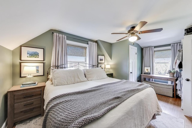 9906 S Saint Louis Ave, Evergreen Park, IL 60805 - bedroom featuring vaulted ceiling, wood finished floors, and a ceiling fan