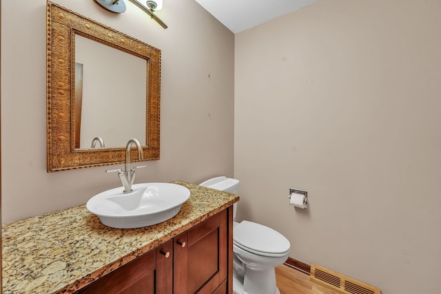 24721 S Walnut St, Crete, IL 60417 - bathroom with vanity, toilet, and wood finished floors