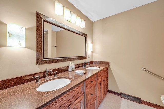 24721 S Walnut St, Crete, IL 60417 - full bath with double vanity, toilet, tile patterned floors, and baseboards