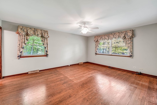 24721 S Walnut St, Crete, IL 60417 - empty room featuring a ceiling fan, wood finished floors, and baseboards