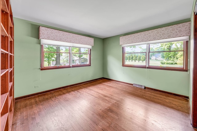 24721 S Walnut St, Crete, IL 60417 - spare room featuring wood finished floors and baseboards