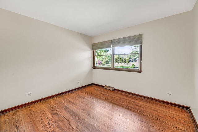 24721 S Walnut St, Crete, IL 60417 - empty room featuring baseboards and wood finished floors