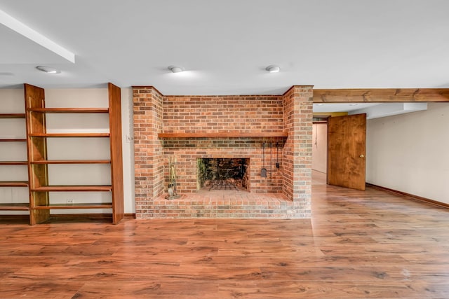 24721 S Walnut St, Crete, IL 60417 - unfurnished living room featuring a fireplace, baseboards, and wood finished floors