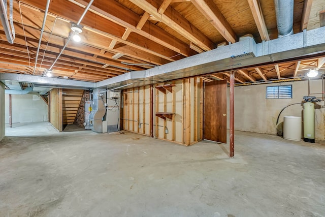 24721 S Walnut St, Crete, IL 60417 - below grade area featuring a water softener, stairway, and gas water heater