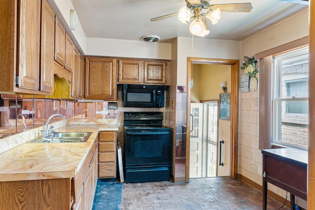 8952 S E End Ave, Chicago, IL 60617 - kitchen with black appliances, a sink, ceiling fan, brown cabinets, and backsplash