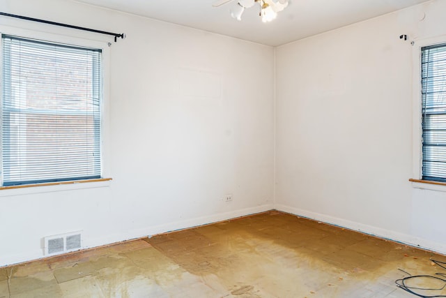 8952 S E End Ave, Chicago, IL 60617 - unfurnished room featuring plenty of natural light, baseboards, and a ceiling fan