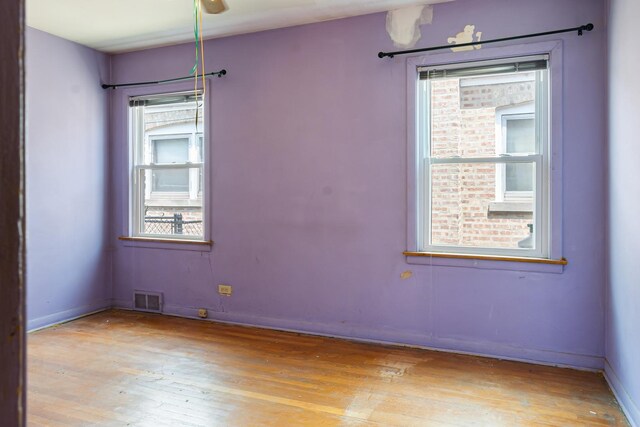 8952 S E End Ave, Chicago, IL 60617 - unfurnished room featuring light wood-style floors and baseboards