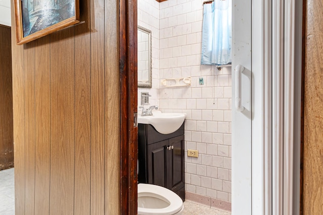8952 S E End Ave, Chicago, IL 60617 - half bath featuring vanity, tile walls, and toilet