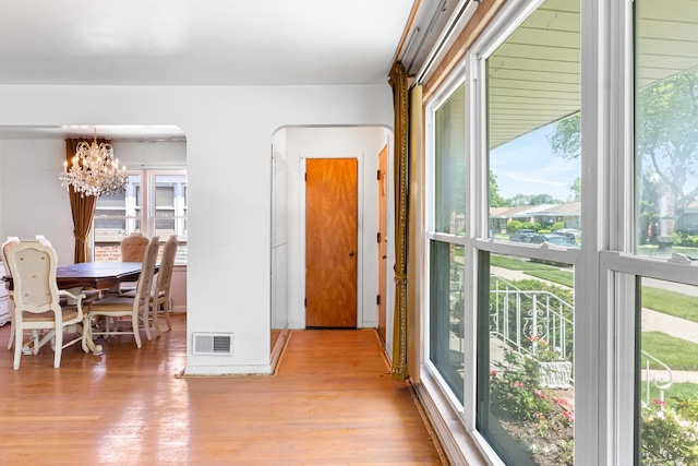 8952 S E End Ave, Chicago, IL 60617 - dining space featuring a chandelier and wood finished floors